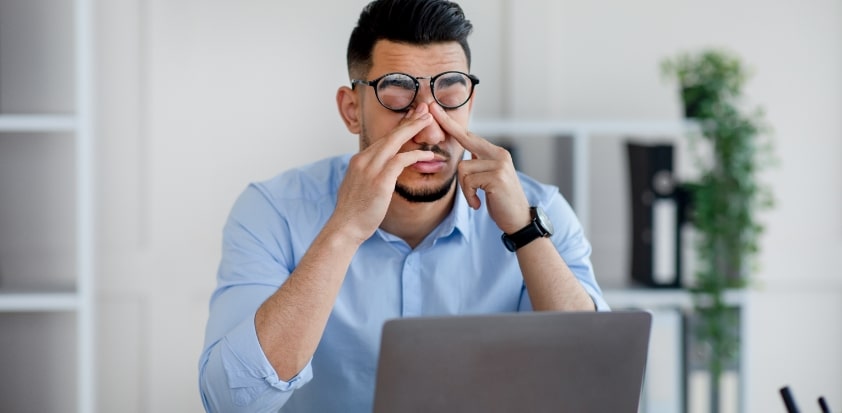 Employee suffering from workplace fatigue.